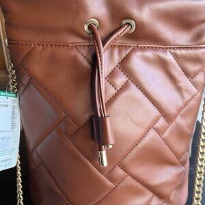 Simons brown quilted bucket bag with gold chains.